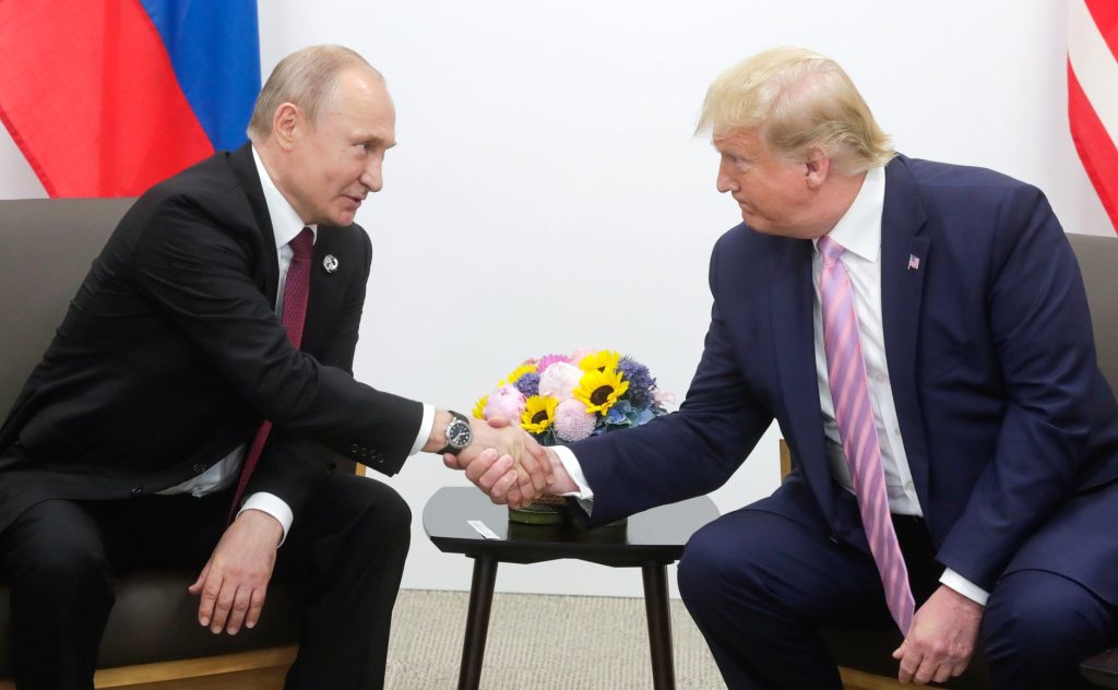 Donald Trump and Vladamir Putin have become increasingly close. Here, shaking hands in his first term in office.