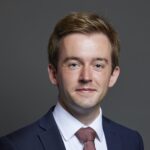 Official portrait of Tom Rutland MP crop 2 1